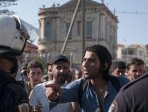 Police batons used against migrants in Lesbos Police batons used against migrants in Lesbos