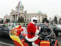Motorcyclists dressed in costumes of Santa Claus Motorcyclists dressed in costumes of Santa Claus