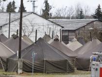 Macedonian police reopen border for a trickle of refugees Macedonian police reopen border for a trickle of refugees