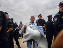EU ministers OK migrant plan by majority EU ministers OK migrant plan by majority